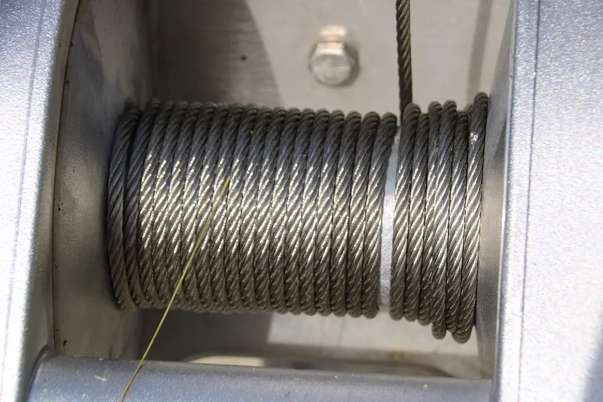 Coiled steel wire rope on spool used for lifting, rigging, and industrial applications.